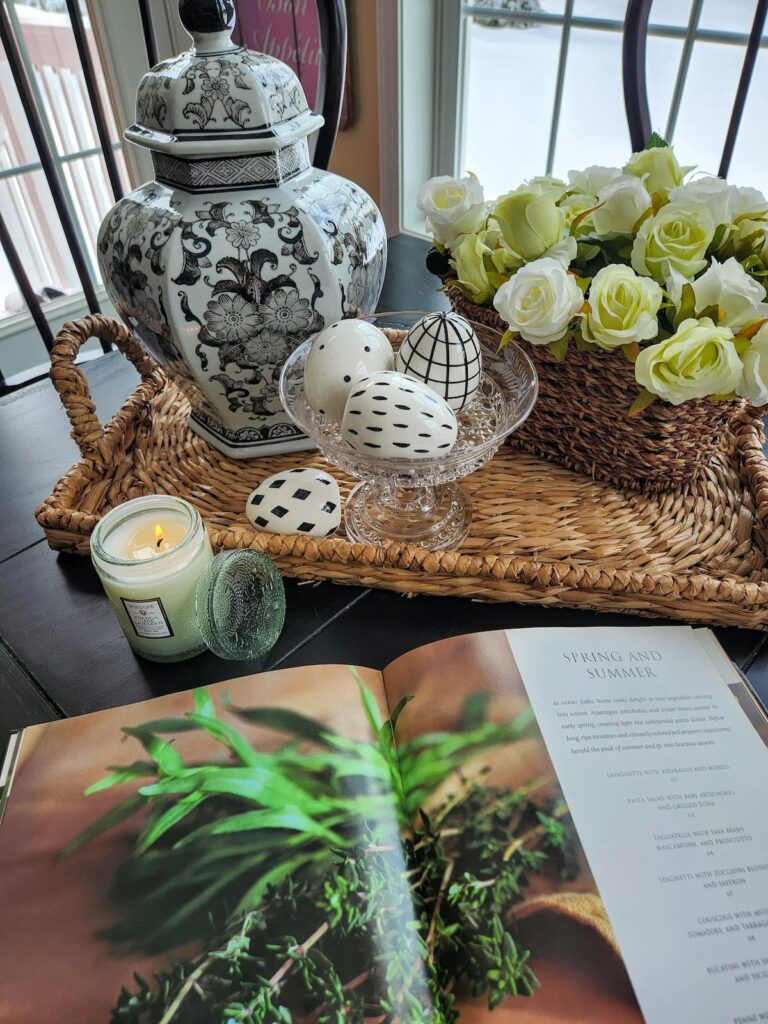 black and white ginger jar on breakfast room table on wicker tray