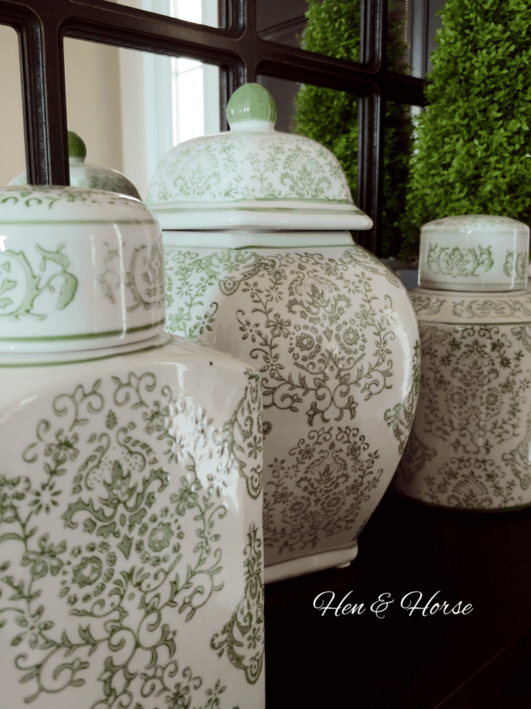 green ginger jars on foyer table