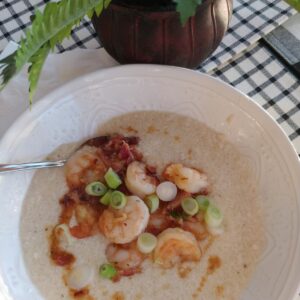 shrimp and grits in bowl on table