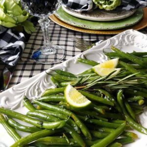 green beans with lime on a white dish
