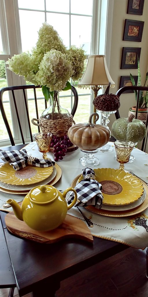 yellow dishes with pumpkins on a table