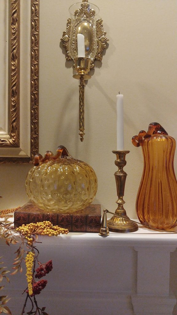 amber pumpkins on mantle