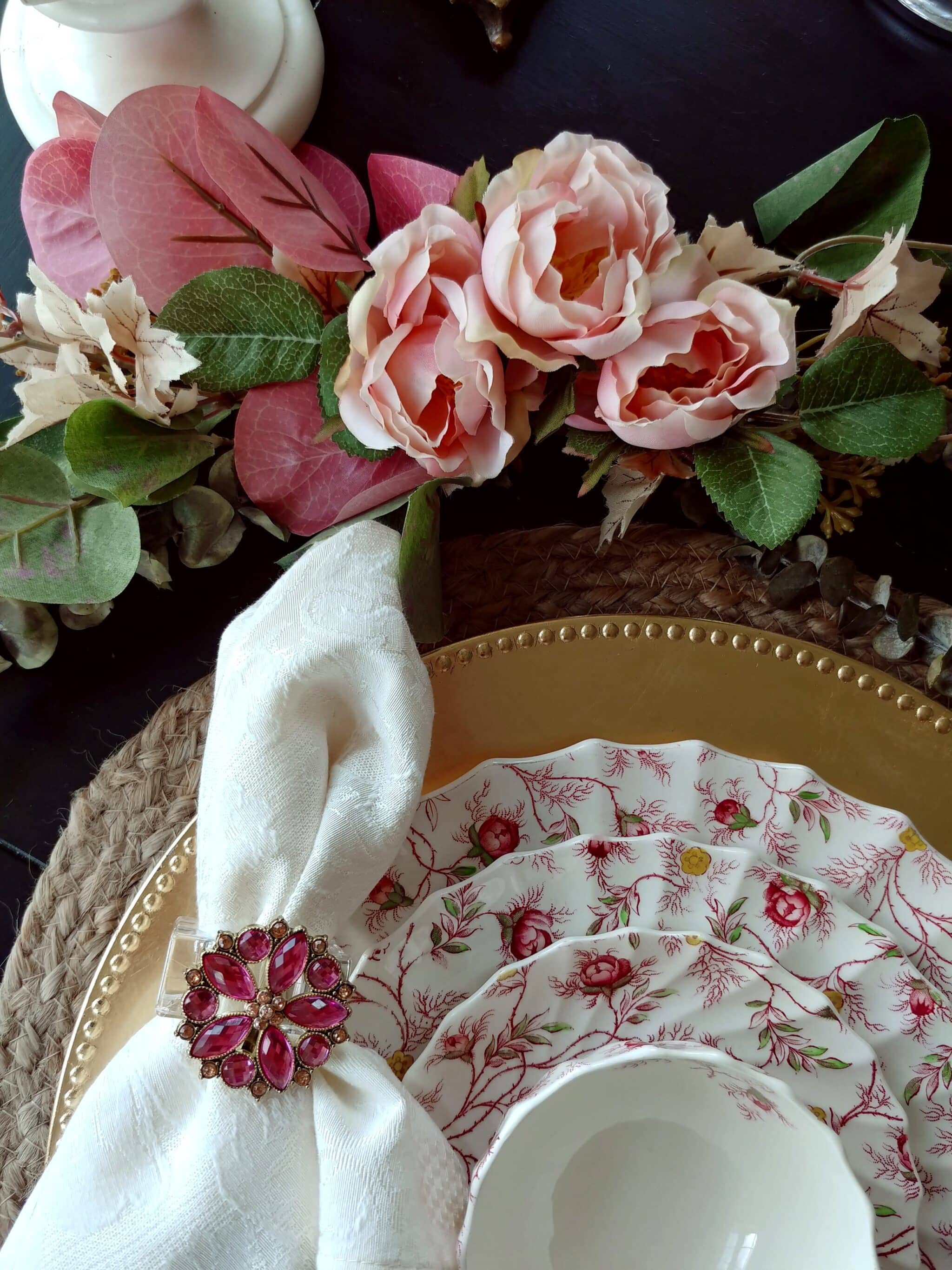 A close up of a flower and dish on table