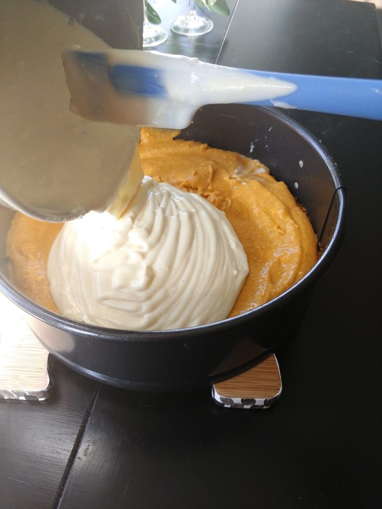 pumpkin mixer being added to pan