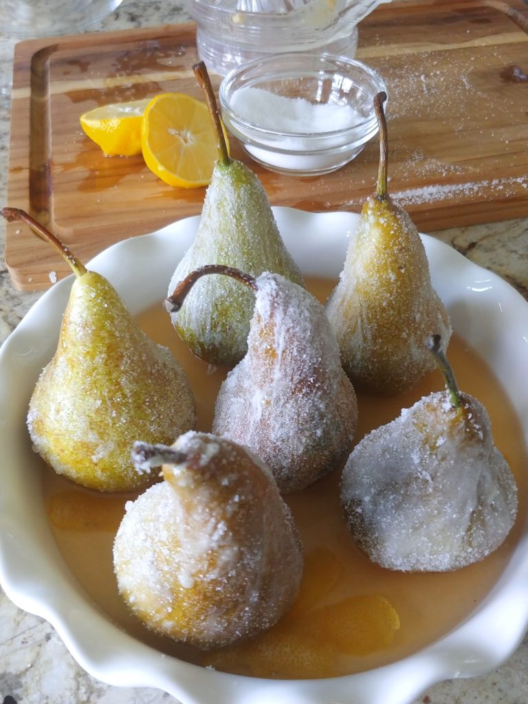 a baking dish filled with pears