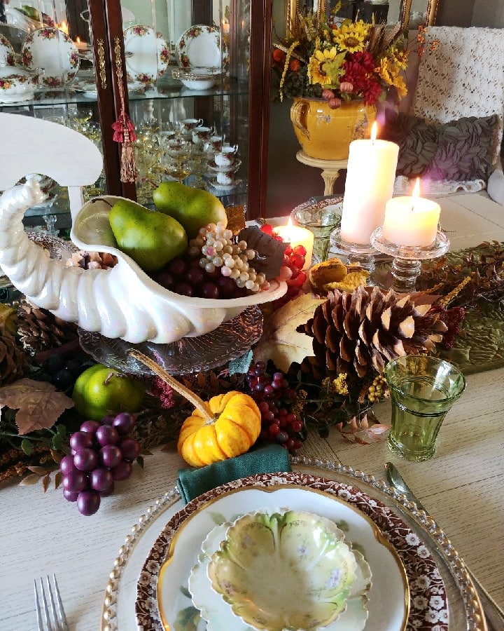 A table topped with plates of food on a plate, with Thanksgiving and Fruit
