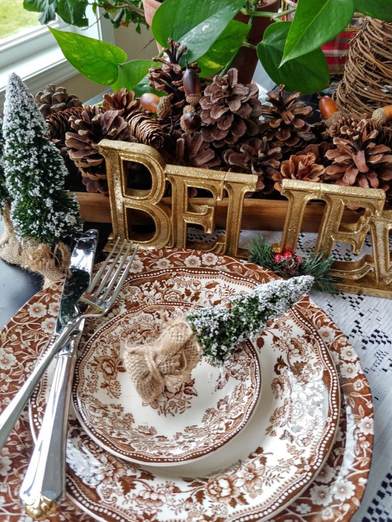 brown transferware with christmas tree on table
