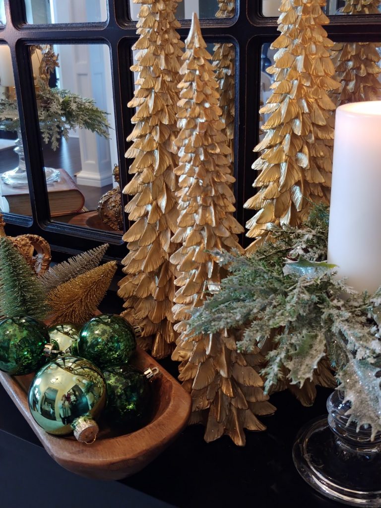gold christmas trees on a table