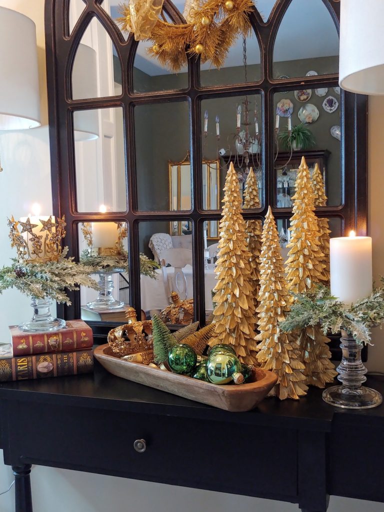 gold christmas trees and a wooden dough bowl on a table