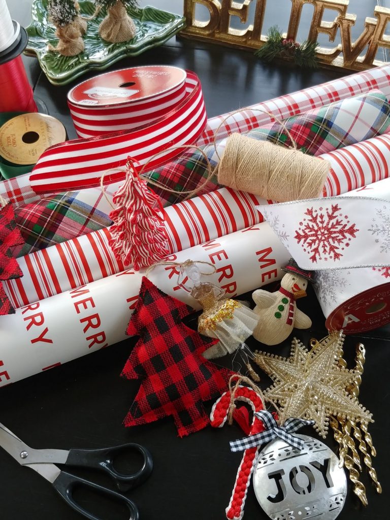 rolls of wrapping paper and ribbon on a table