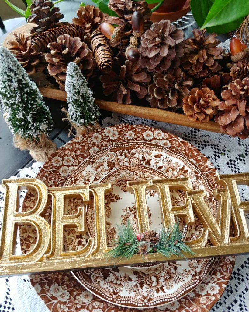 A close up of a believe sign on table