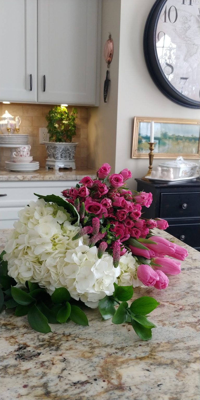 A bouquet of flowers on the counter