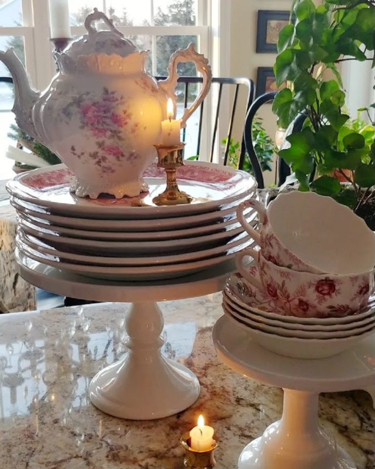 vintage dishes stacked on pedestal stand