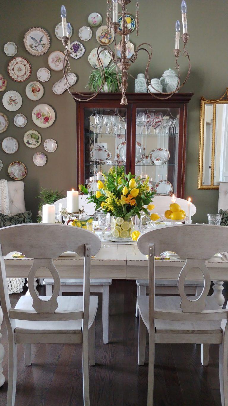 A room filled with furniture and vase of flowers on a table