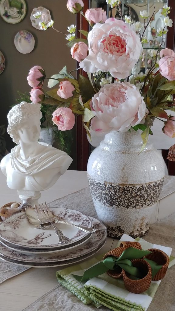 A close up of a vase of flowers on a table