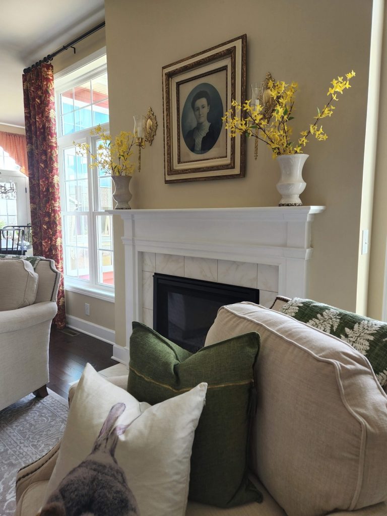 A living room filled with furniture and a large window