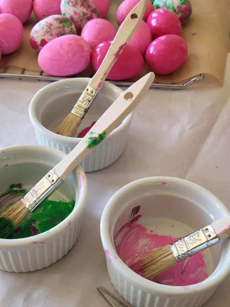 Cups of Paint for Easter Egg Painting on a table