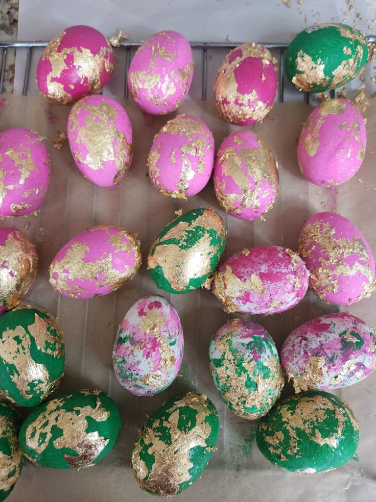 A close up of a bunch of pink easter eggs