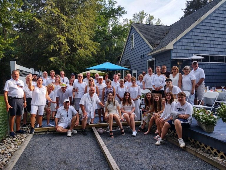 A group of people posing for the camera at a bocce party