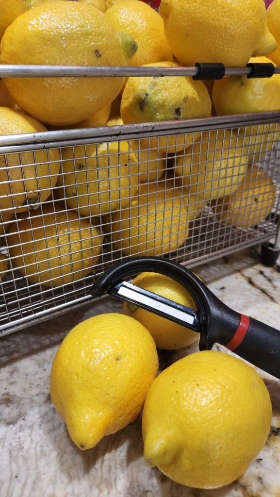 Lemons in Strainer with peeler