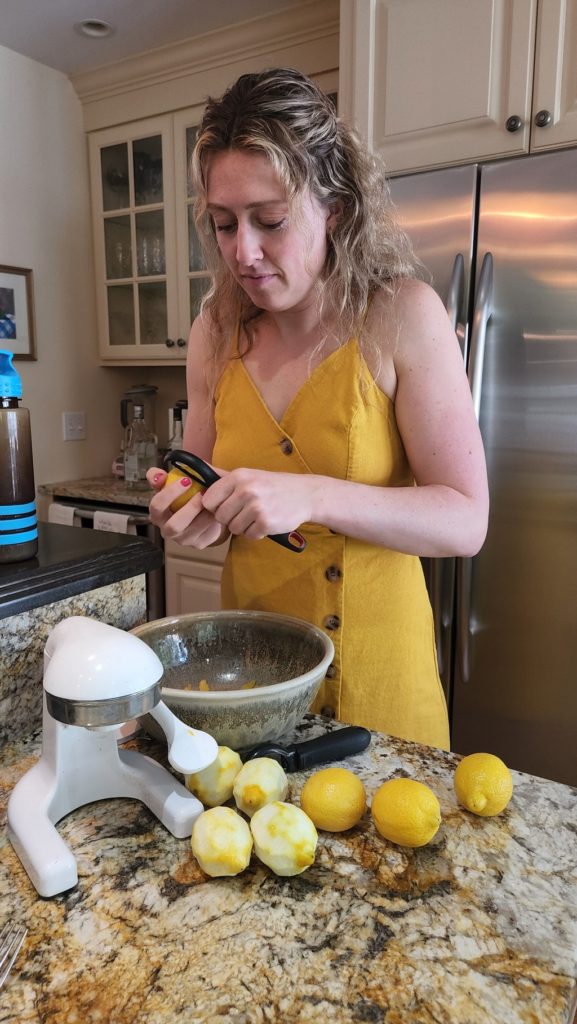 Lady peeling lemons