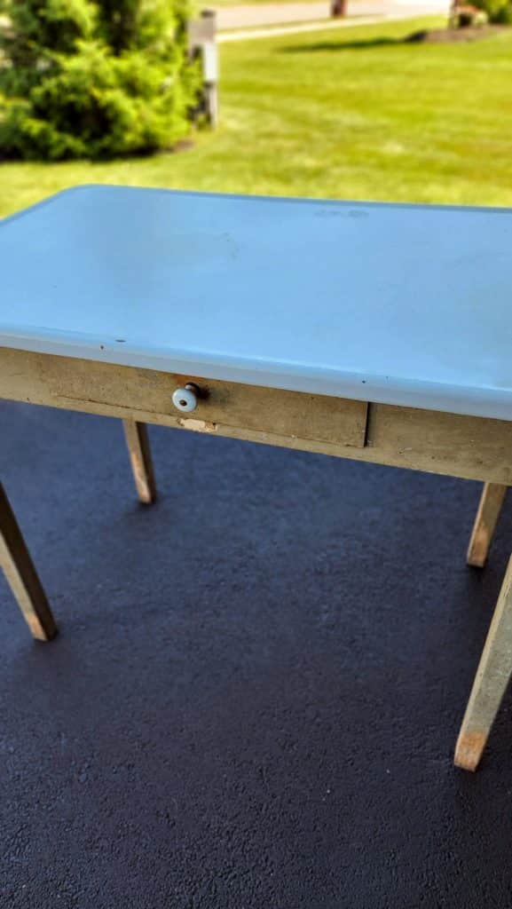old wooden table with chipped drawer