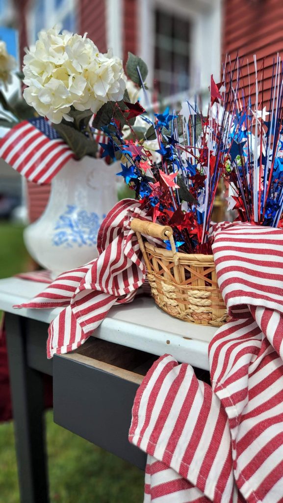 red white striped napkins with flags in a pticher