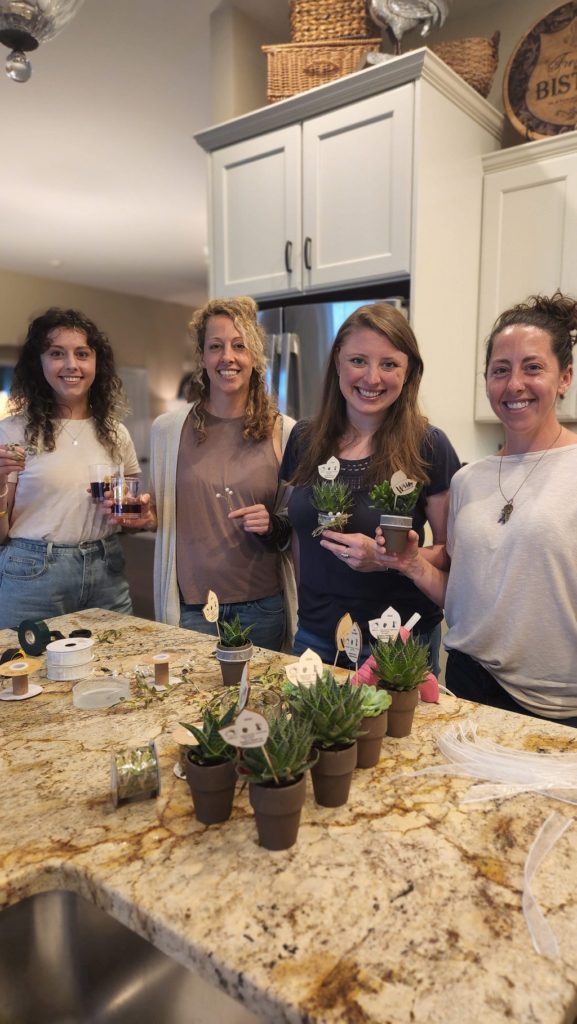 ladies holding succulent bridal favors