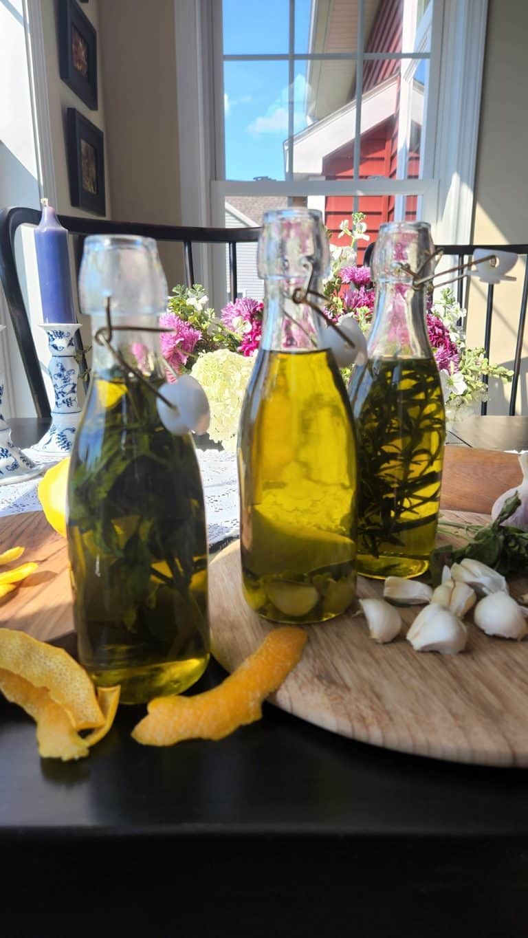 bottles of olive oil with herbs inside