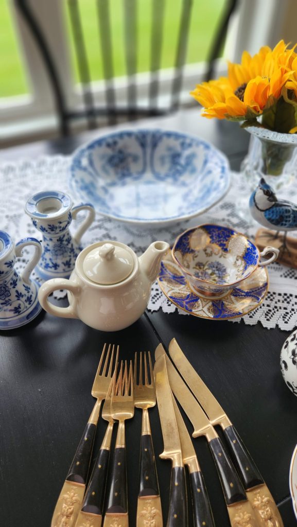 blue bowl, white teapot on table with teacup