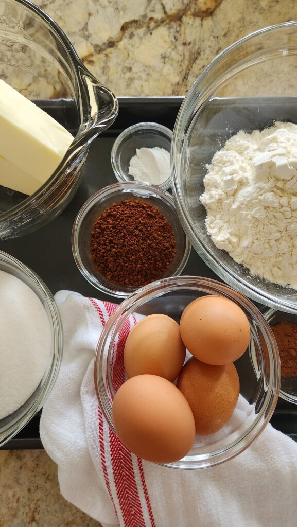 overhead view of eggs, flour, butter, sugar