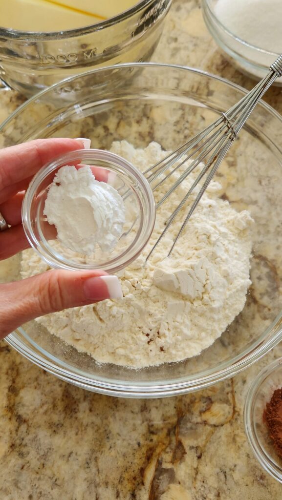 glass bowl with flour, adding baking powder