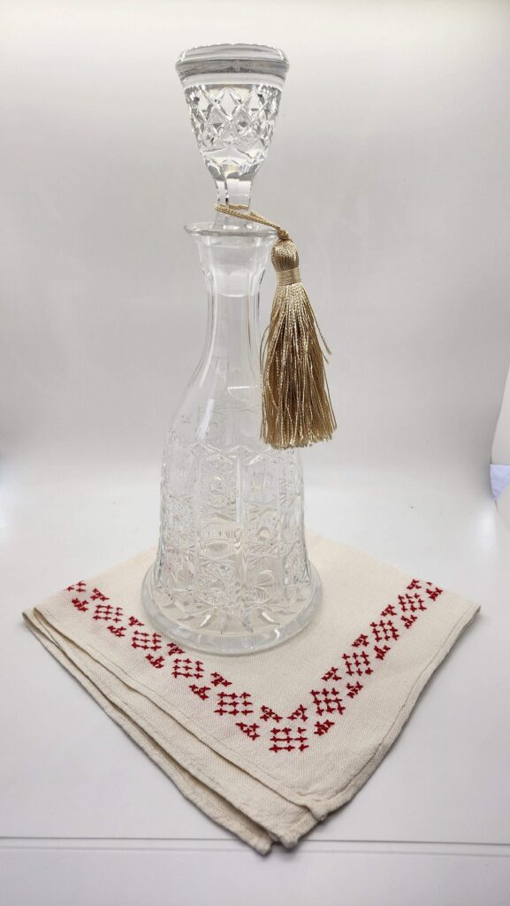 vintage glass wine decanter with tassle on it