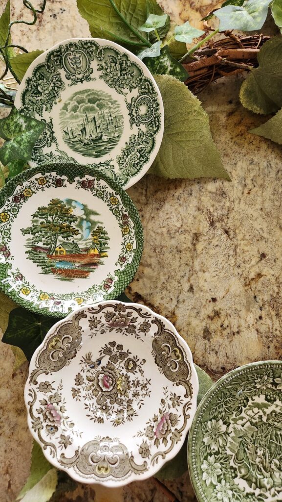 tea saucers laid out on top of grapevine wreath