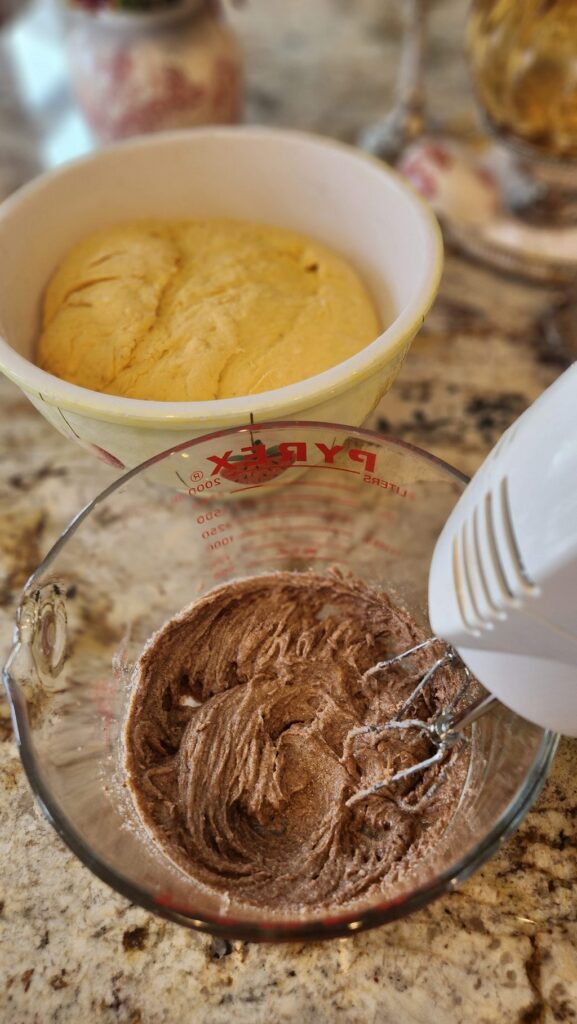 hand mixer mixing filling for pumpkin buns