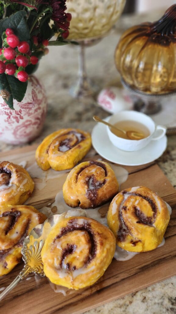 pumpkin buns on counter with teacup on side