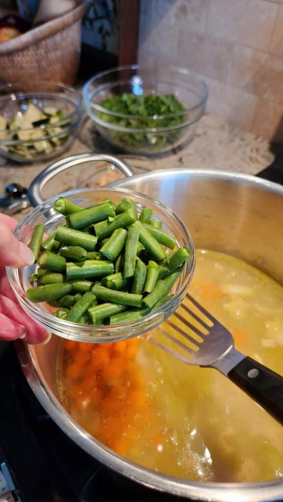fresh green beans in glass bowl ready for soup