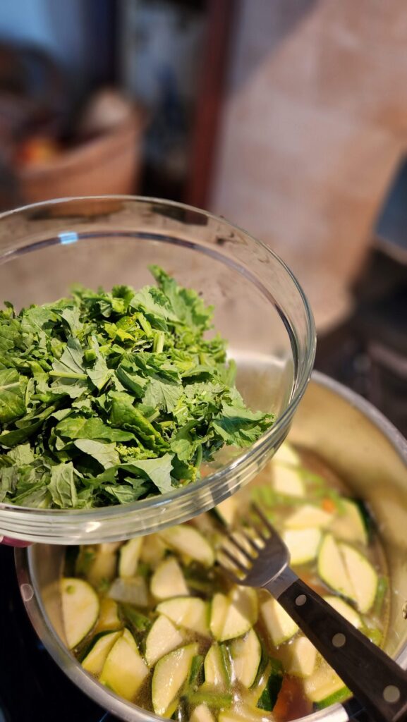 bowl of cut up broccoli rabe for soup