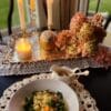 minestrone soup on table with candles lit