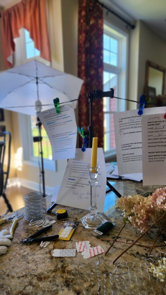written notes hanging from a string with a light umbrella in background