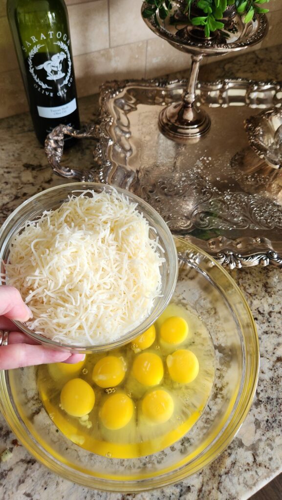 swiss & gruyere cheese shredded in glass bowl