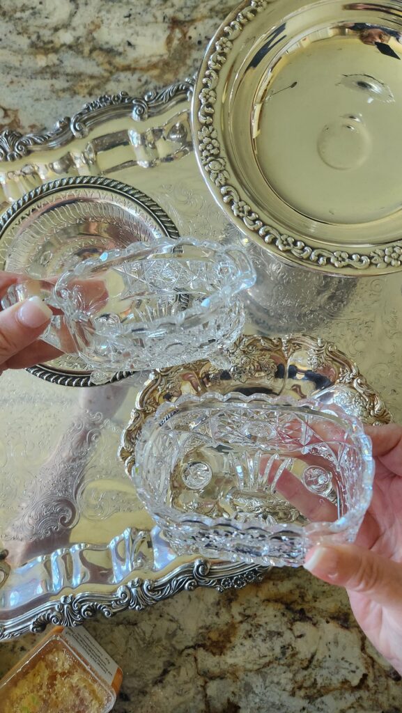 crystal creamer and sugar over a silver platter