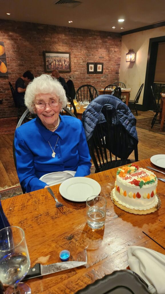 lady at table celebrating her 90th birthday