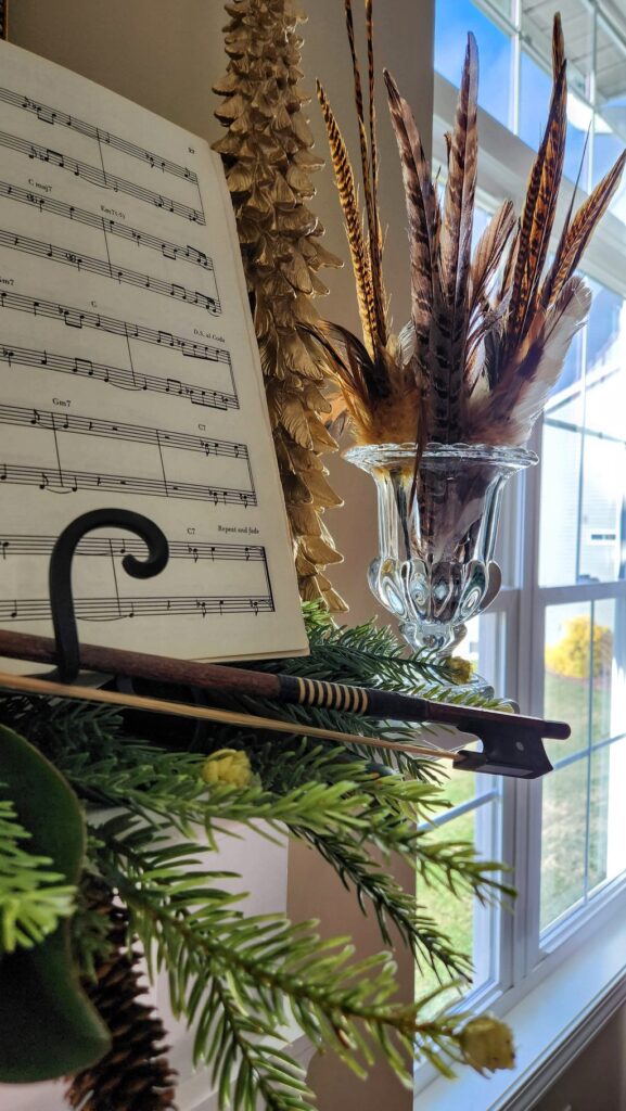 Christmas mantel with sheet music and violin string