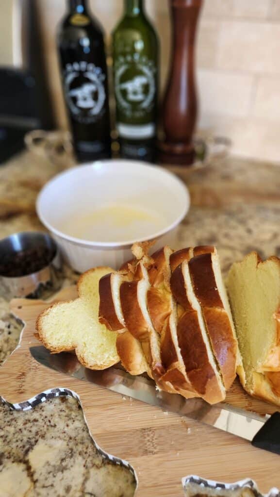 challah bread sliced with souffle bowl ready for baking
