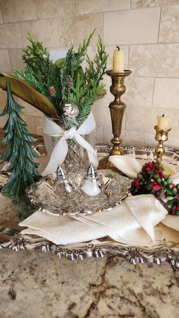 silver tray on kitchen counter with christmas greenery in glass jar & small green christmas tree