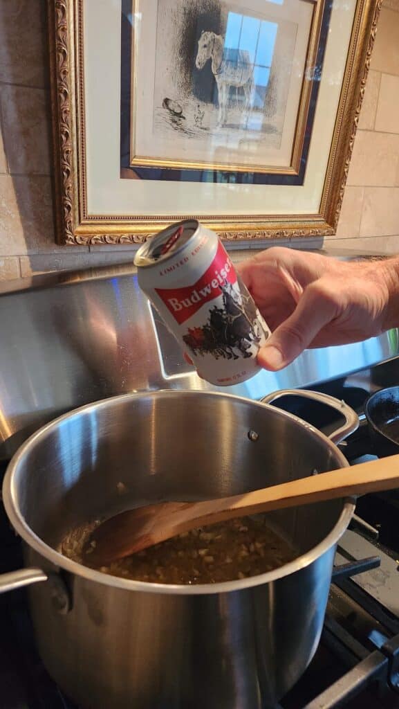 can of budweiser beer being poured into seafood boil