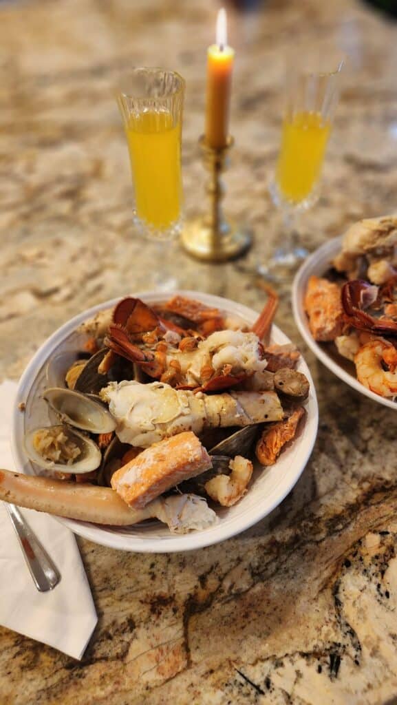 seafood boil ready to eat with candle light on counter top