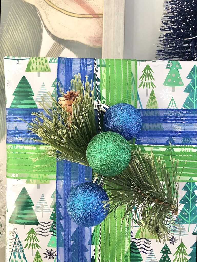 colorful christmas wrapped gift with green and blue