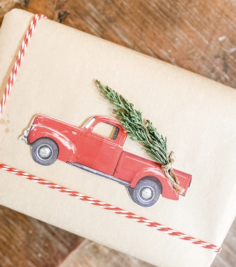 christmas wrapping with red truck and greens attached